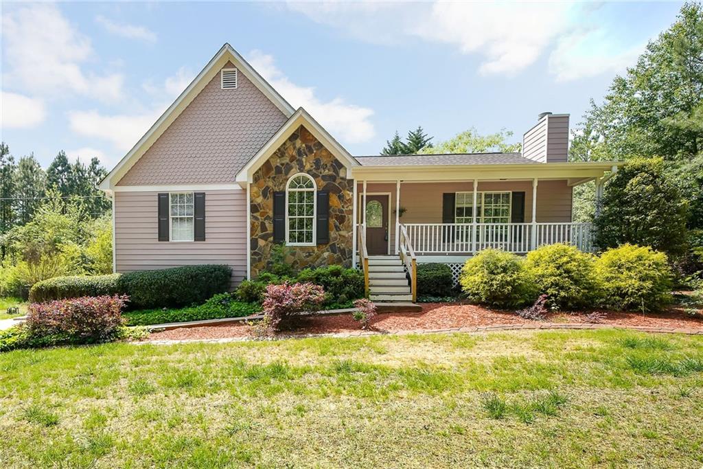1206 Macland Road Dallas, GA 30132 - Photo 1 of 1 a front view of a house with a yard