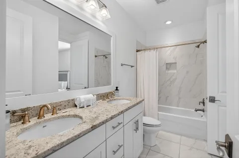 a front view of a house with outdoor seating