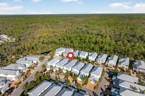 a swimming pool with outdoor seating and garden