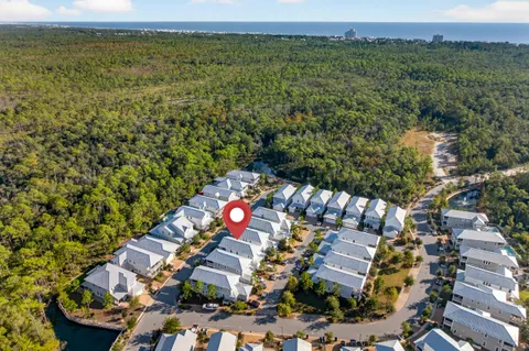 a view of a lake with houses in the back