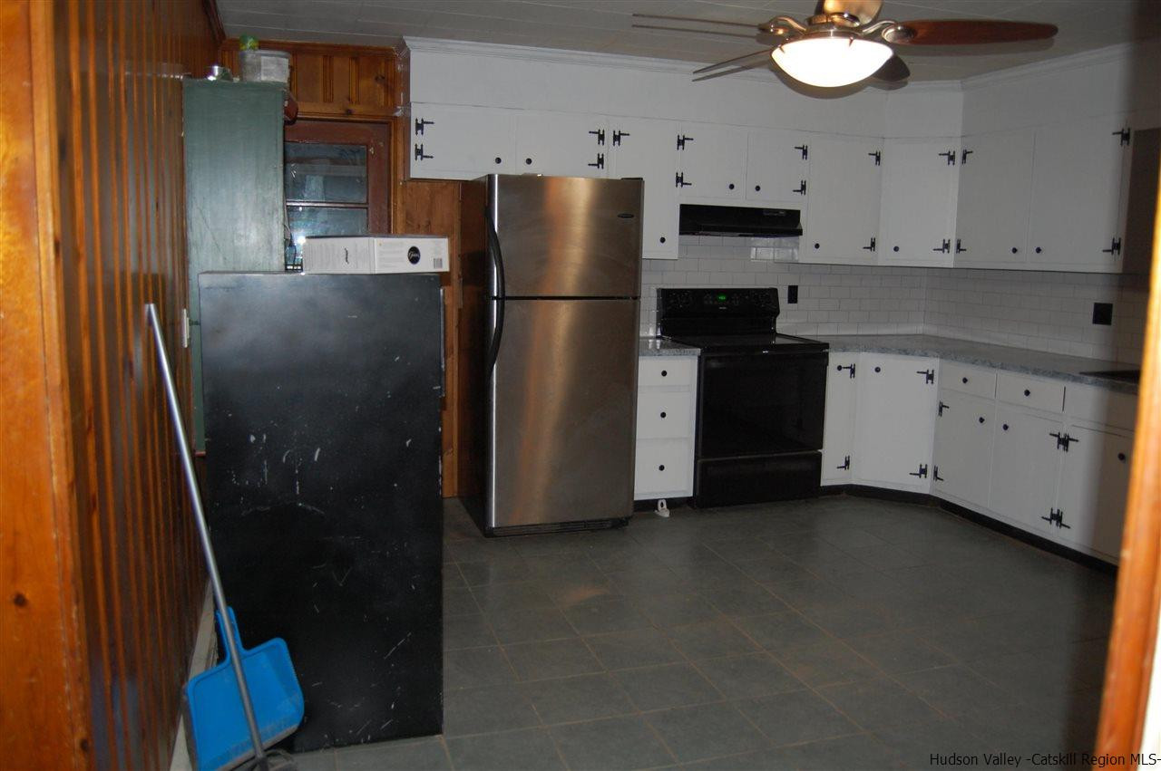 12 Cafaldo Drive Saugerties, NY 12477 - Photo 3 of 17 a kitchen with a refrigerator and a sink