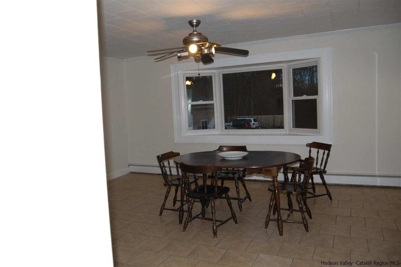 12 Cafaldo Drive Saugerties, NY 12477 - Photo 5 of 17 a view of a dining room with furniture and chandelier