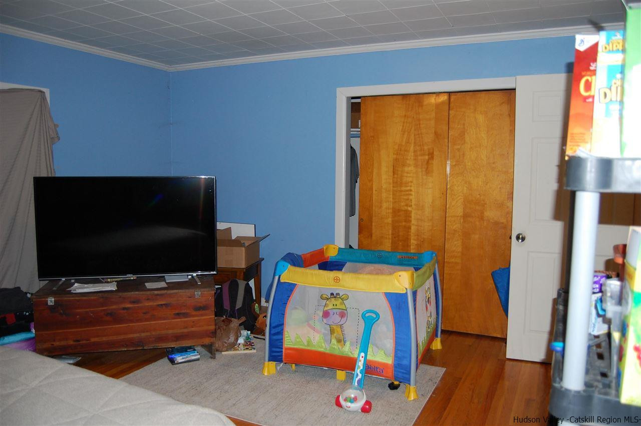 12 Cafaldo Drive Saugerties, NY 12477 - Photo 8 of 17 a living room with furniture and a flat screen tv