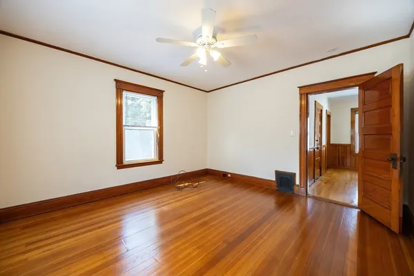 a view of a bathroom with wooden floor