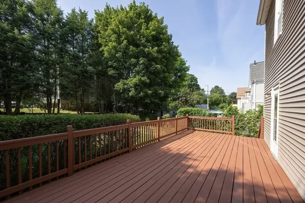 a view of balcony with deck and wooden floor