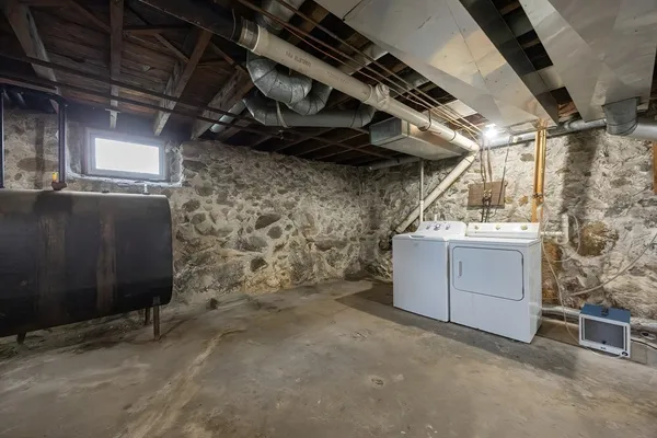 a utility room with a wooden floor