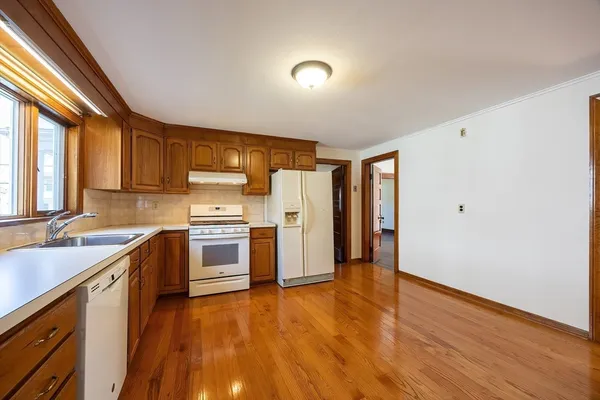 a view of a livingroom with furniture and wooden floor