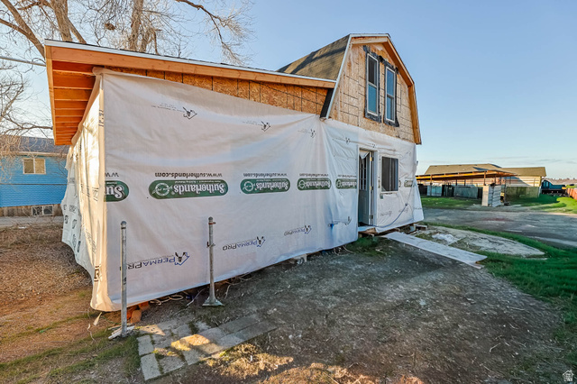 7609 Mountain View Road Lake Point, UT 84074 - Photo 15 of 16 View of home's exterior featuring a gambrel roof