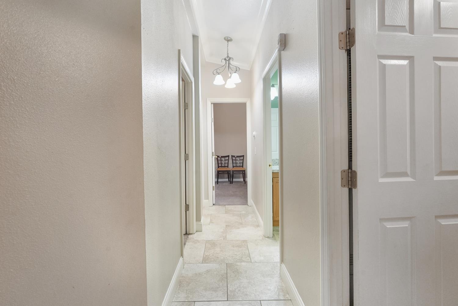 2841 Fowler Road, Unit 33 Ceres, CA 95307 - Photo 13 of 29 a view of a hallway with wooden shelves