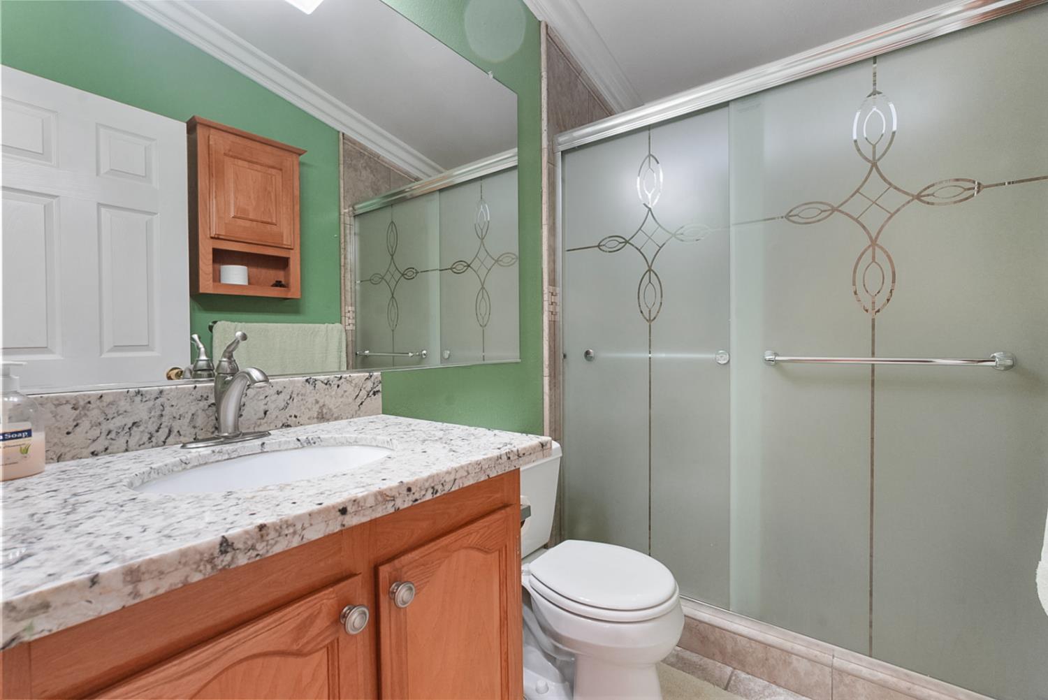 2841 Fowler Road, Unit 33 Ceres, CA 95307 - Photo 15 of 29 a bathroom with a granite countertop sink toilet and shower