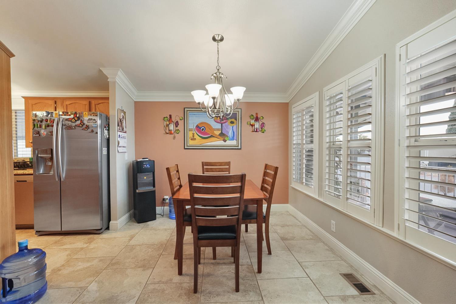 2841 Fowler Road, Unit 33 Ceres, CA 95307 - Photo 9 of 29 a dining room filled with furniture and a chandelier