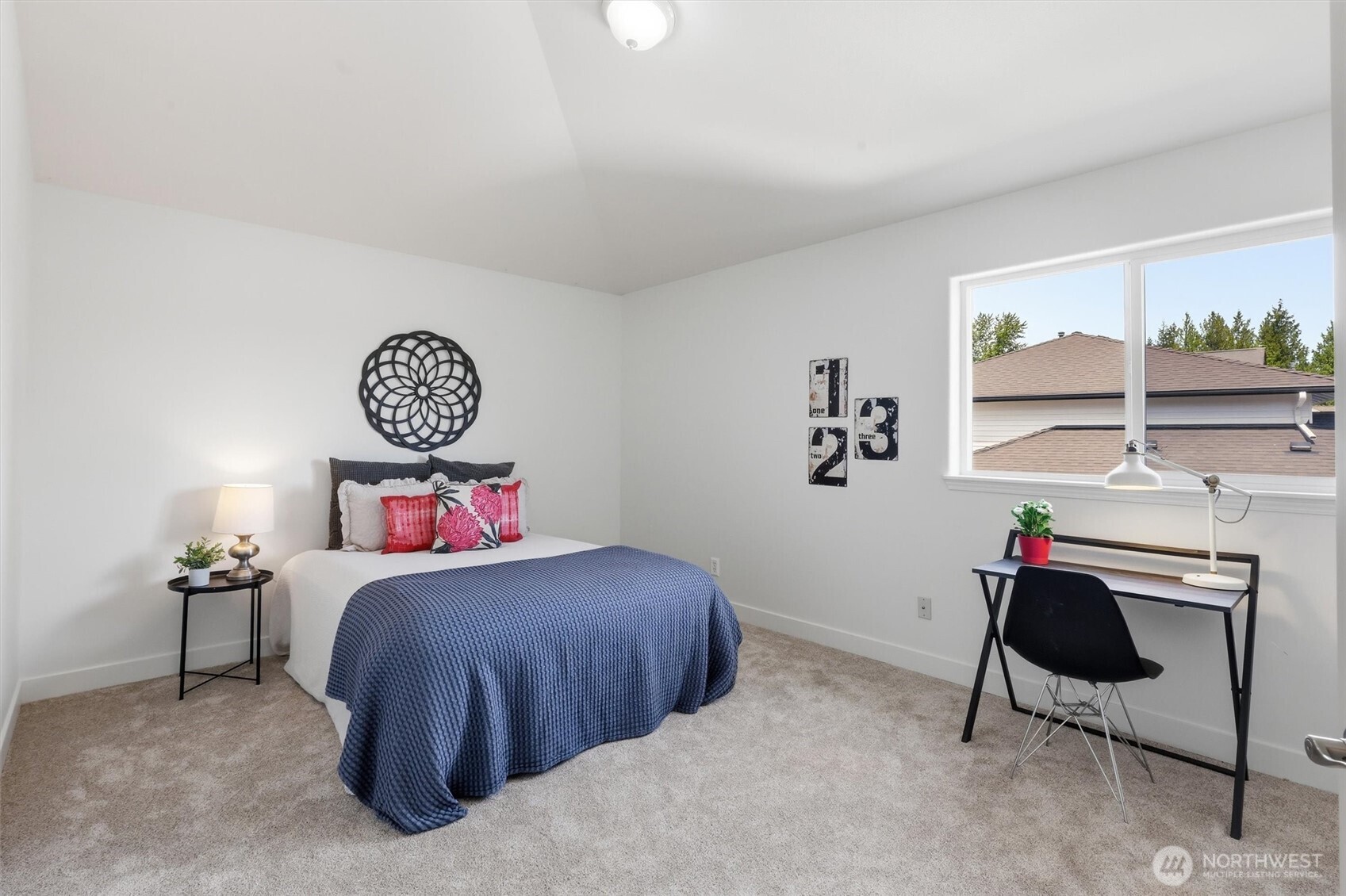 5523 East Wishon Road Snohomish, WA 98290 - Photo 25 of 39 a bedroom with a bed and a chandelier