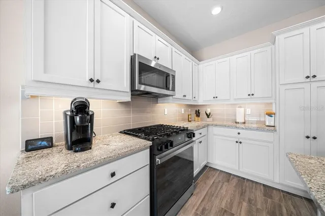 a bathroom with a sink vanity and a mirror