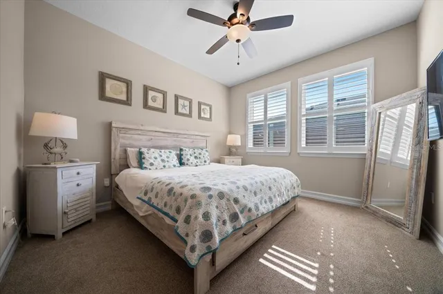 a bathroom with a granite countertop sink a toilet a mirror and shower