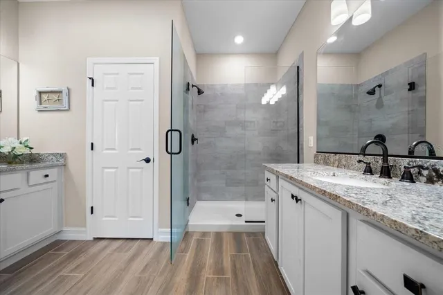 a view of houses with a swimming pool and a yard