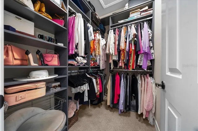 a sign that is sitting in the grass next to a building