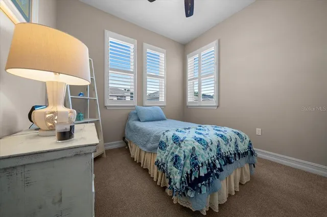 a view of a swimming pool with a table and chairs