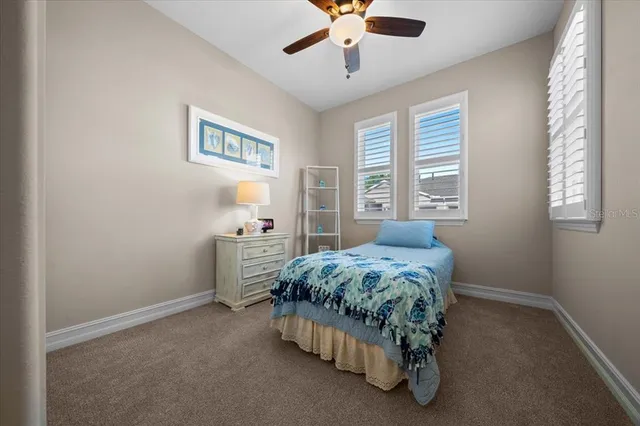 a living room with fireplace furniture and a large window