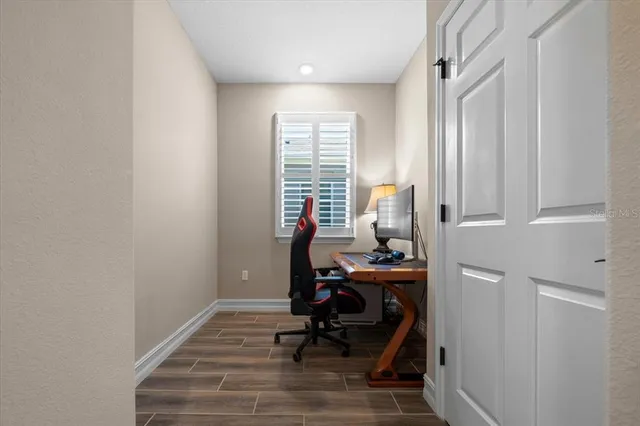 a view of a lake with houses in the background