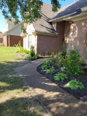 a front view of a house with garden