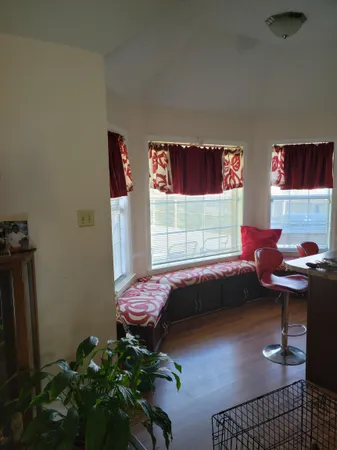a bedroom with furniture and a potted plant