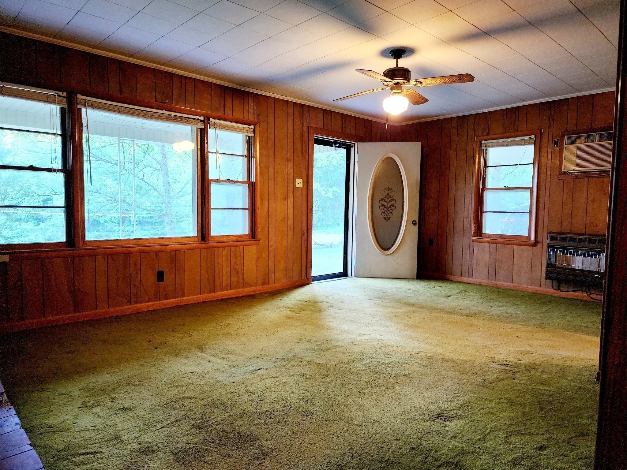 9558 Mt Carmel Road Decaturville, TN 38329 - Photo 17 of 24 a view of an empty room with a window and a kitchen