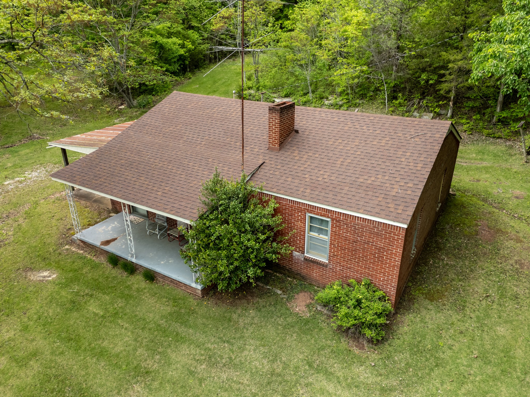 9558 Mt Carmel Road Decaturville, TN 38329 - Photo 2 of 24 an aerial view of a house having yard