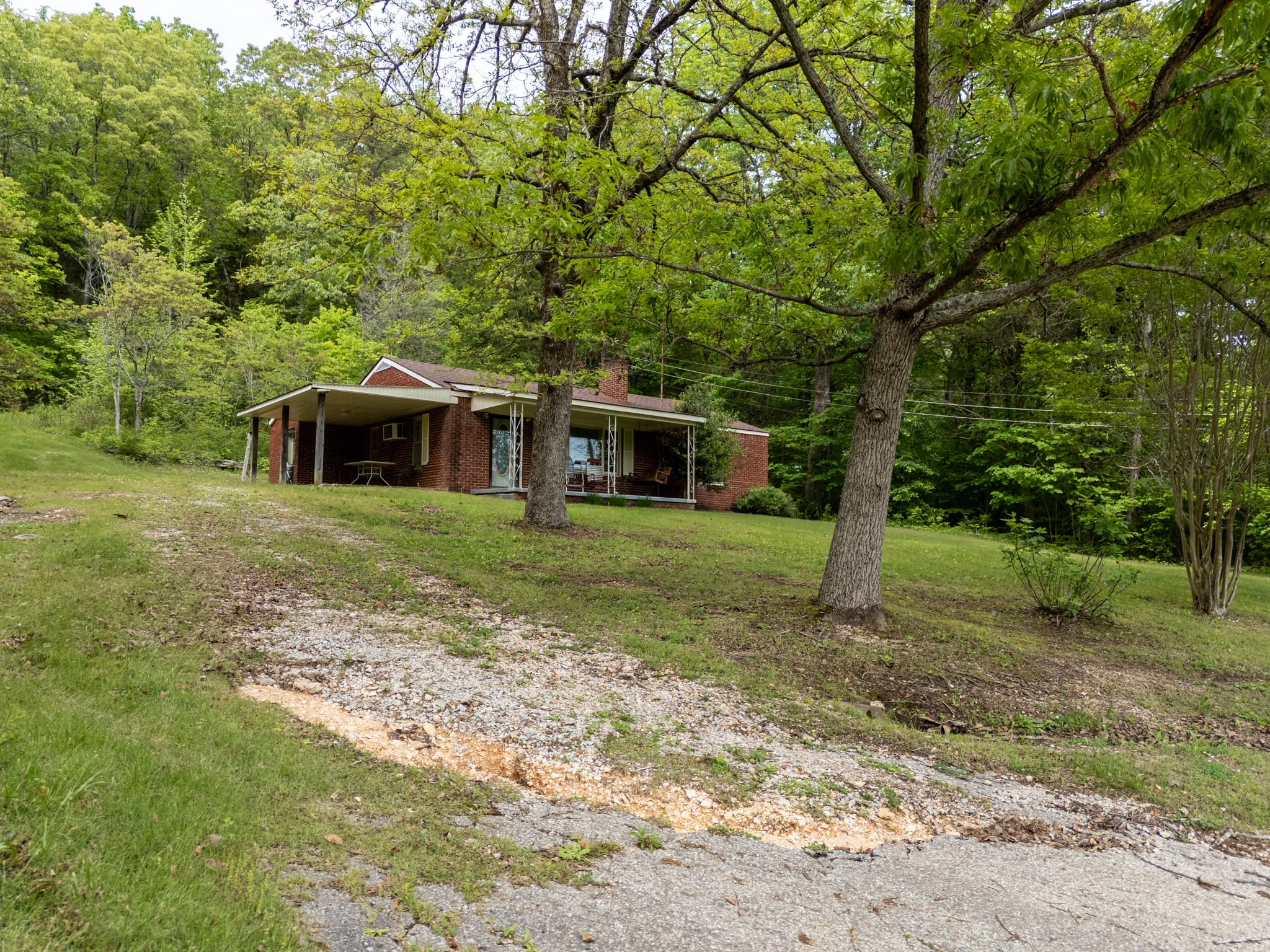 9558 Mt Carmel Road Decaturville, TN 38329 - Photo 7 of 24 a view of a house with a yard