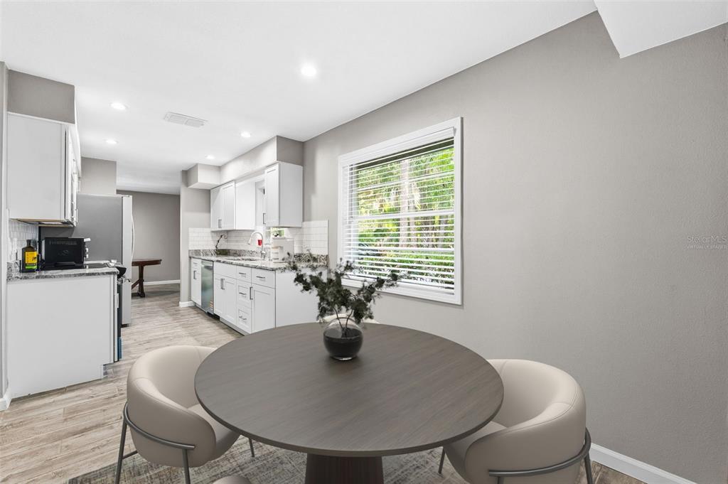 12210 State Street Tampa, FL 33635 - Photo 18 of 41 a dining room with furniture and window