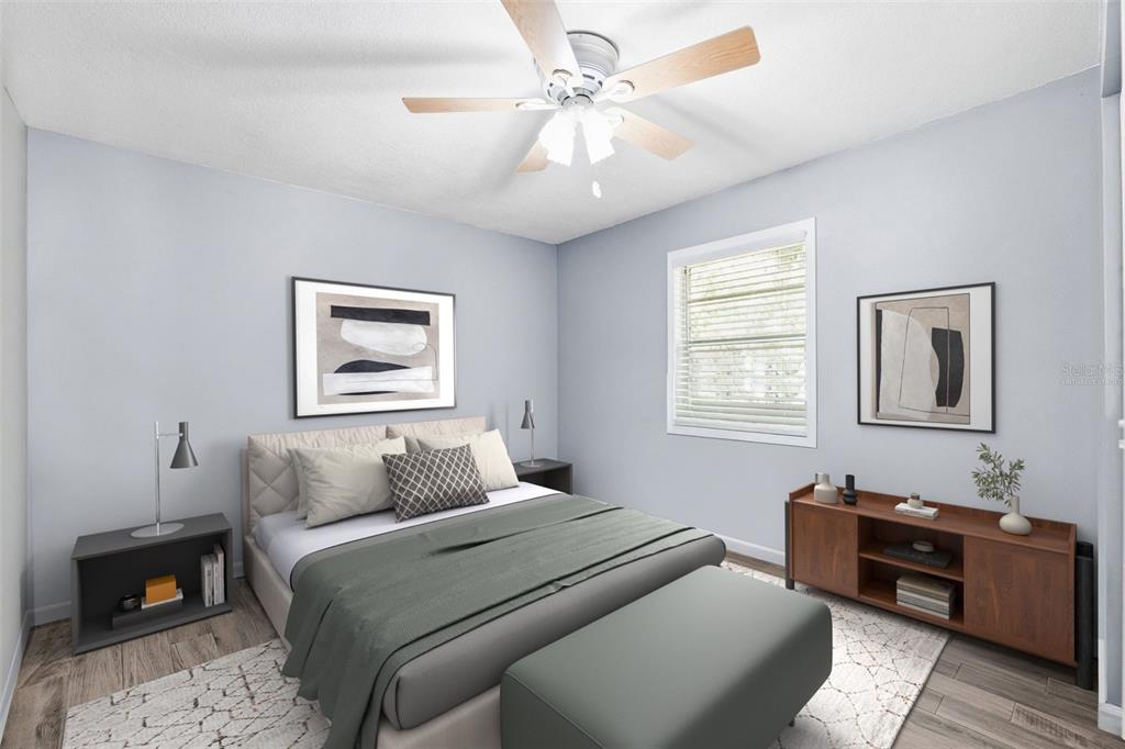 12210 State Street Tampa, FL 33635 - Photo 30 of 41 a bedroom with a bed and wooden floor