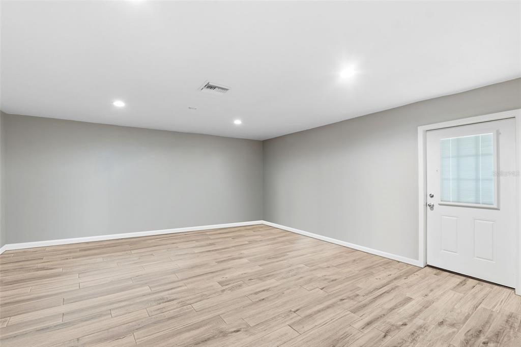 12210 State Street Tampa, FL 33635 - Photo 32 of 41 a view of an empty room with wooden floor