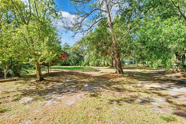 a view of outdoor space with deck and yard