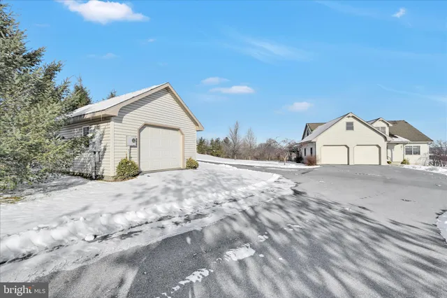 a dining room with furniture a rug and a chandelier