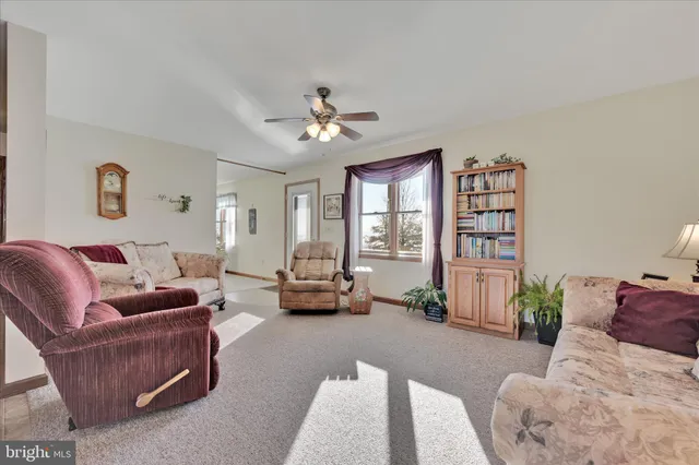 a view of kitchen with furniture and wooden floor
