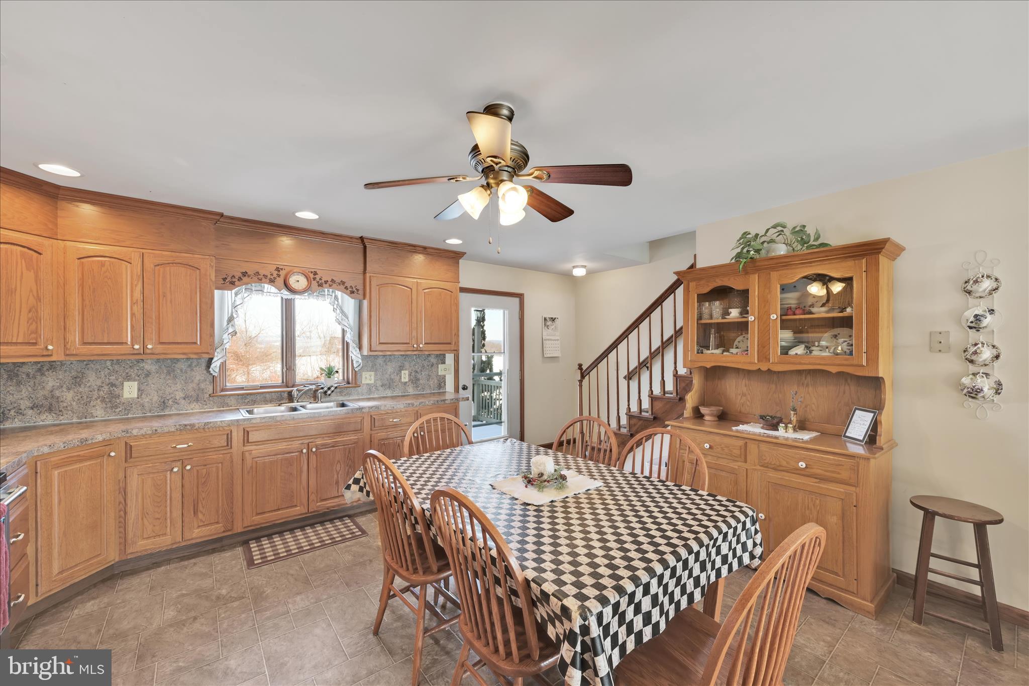 36 Host Road Womelsdorf, PA 19567 - Photo 22 of 78 a dining room with furniture a rug and a chandelier