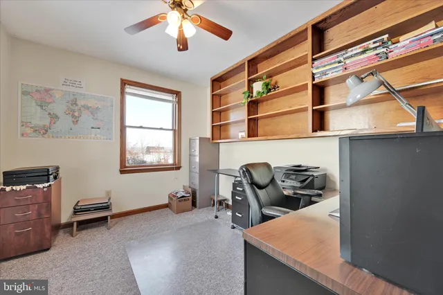 a kitchen with a table chairs and a refrigerator