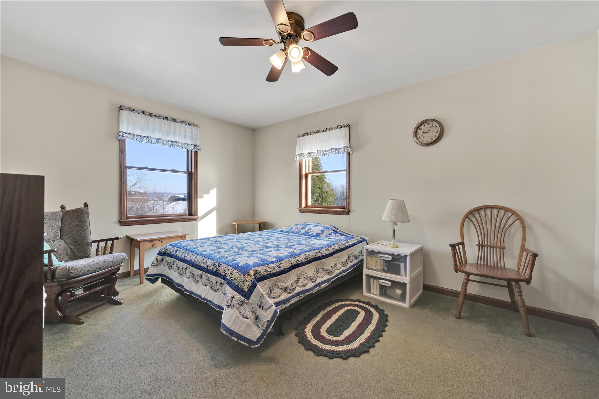 36 Host Road Womelsdorf, PA 19567 - Photo 31 of 78 a bedroom with a bed and a chandelier