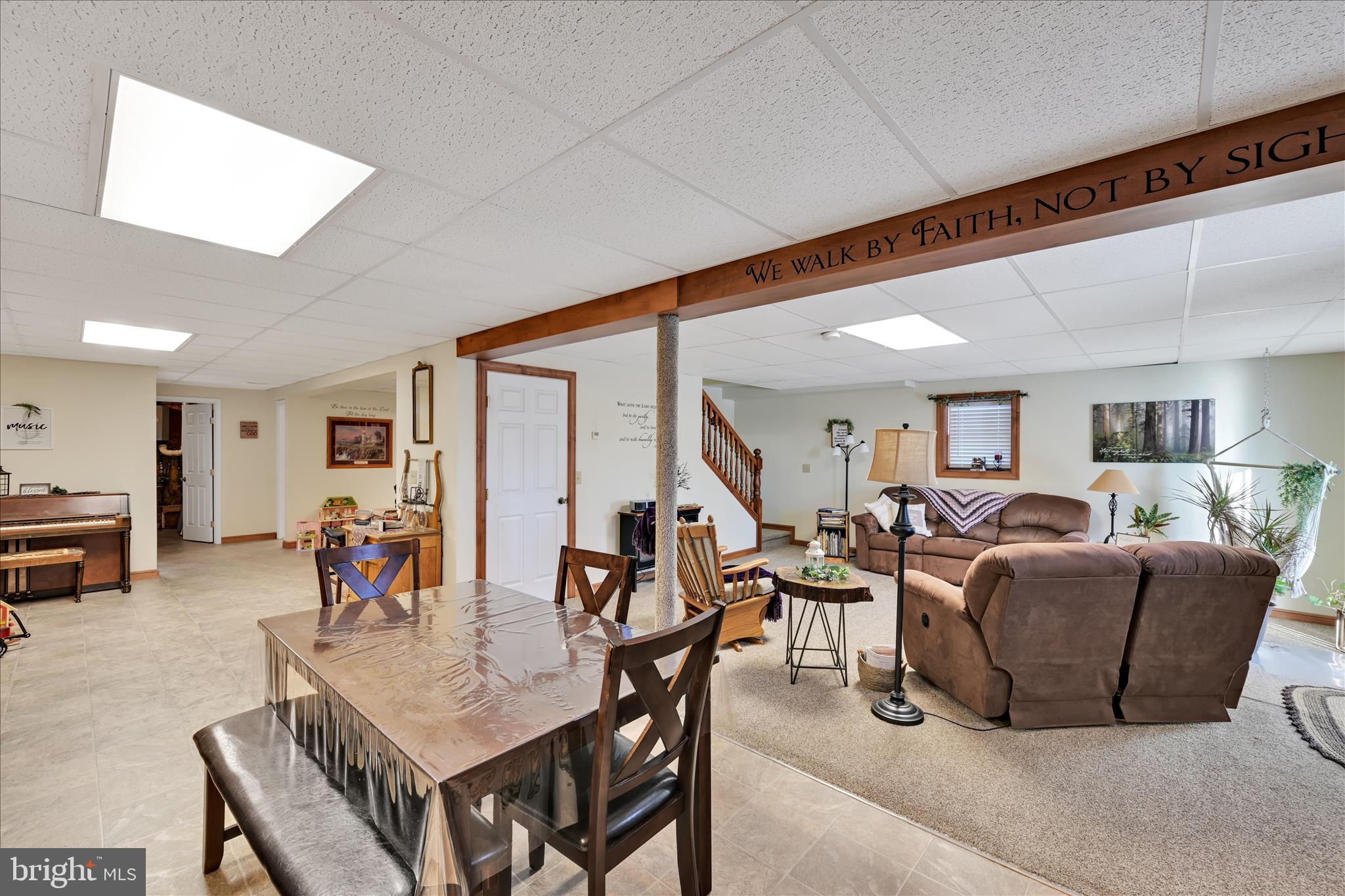 36 Host Road Womelsdorf, PA 19567 - Photo 38 of 78 a living room with furniture a flat screen tv and a large window