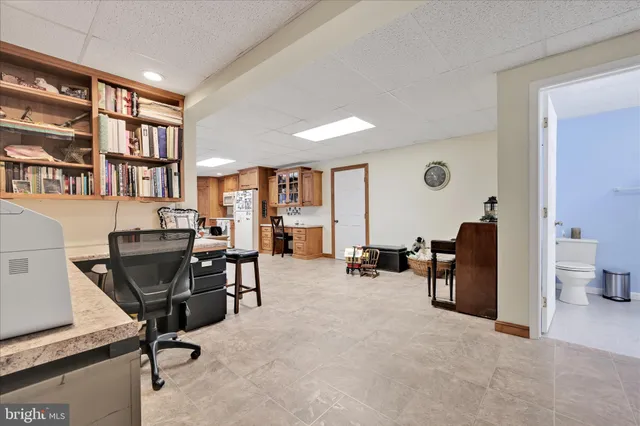a wooden bench sitting in middle of a snow