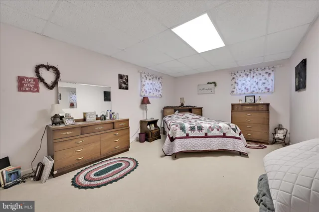 a view of a house with a backyard and a garage