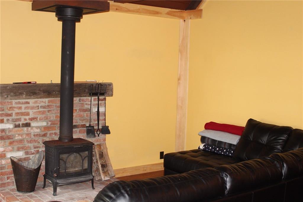 11 Willie Road Stratton, ME 04982 - Photo 15 of 23 Wood burning fireplace in living room.