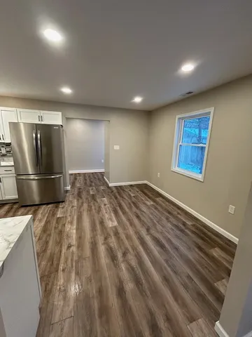 a room with a bed and a lamp