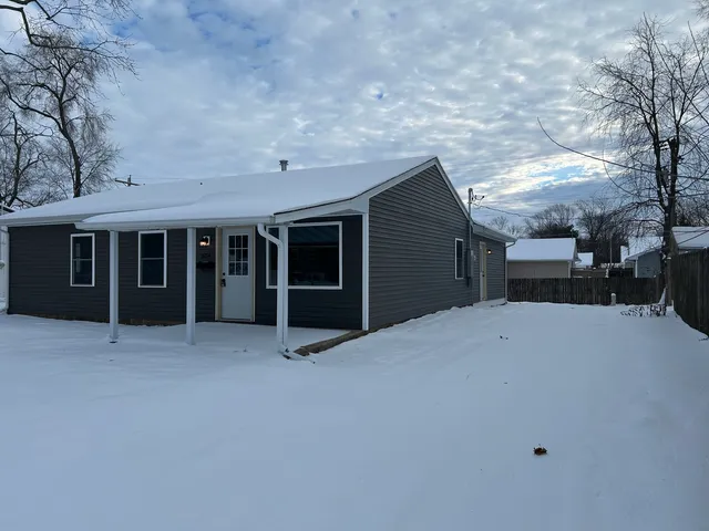 a view of a house with a large window