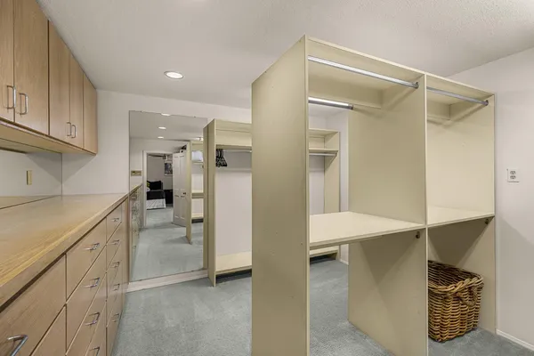 a kitchen with a refrigerator and a sink