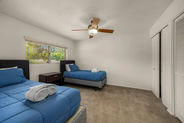 a bedroom with furniture and a window