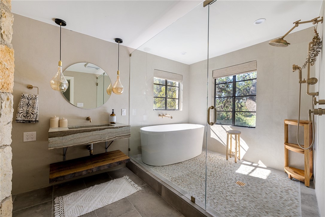 710 Flite Acres Road Wimberley, TX 78676 - Photo 15 of 40 Every bath in this home innovative and latest design. First Floor Primary Bathroom.