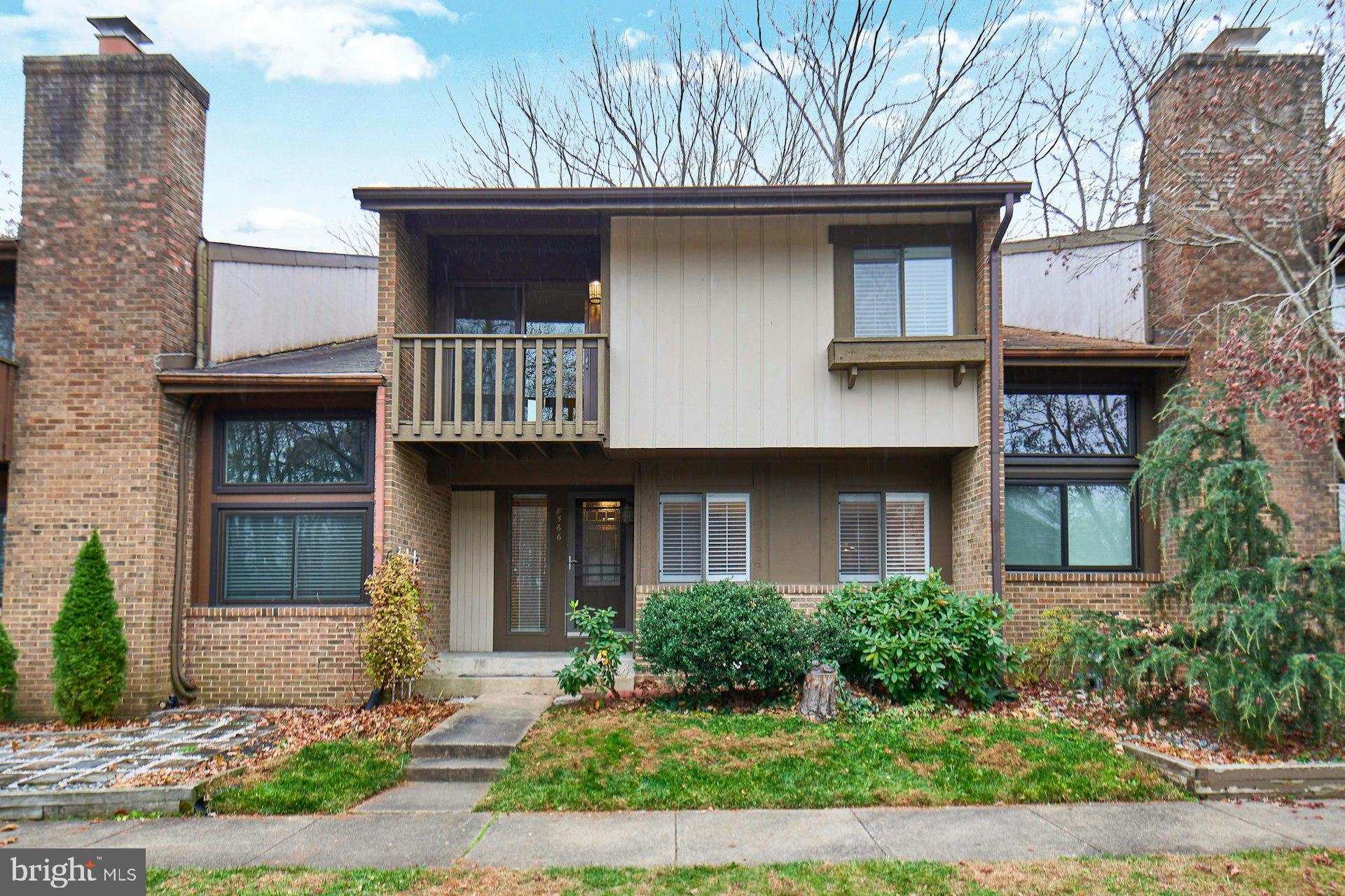 8566 Gwynedd Way Springfield, VA 22153 - Photo 2 of 61 a front view of a house with garden