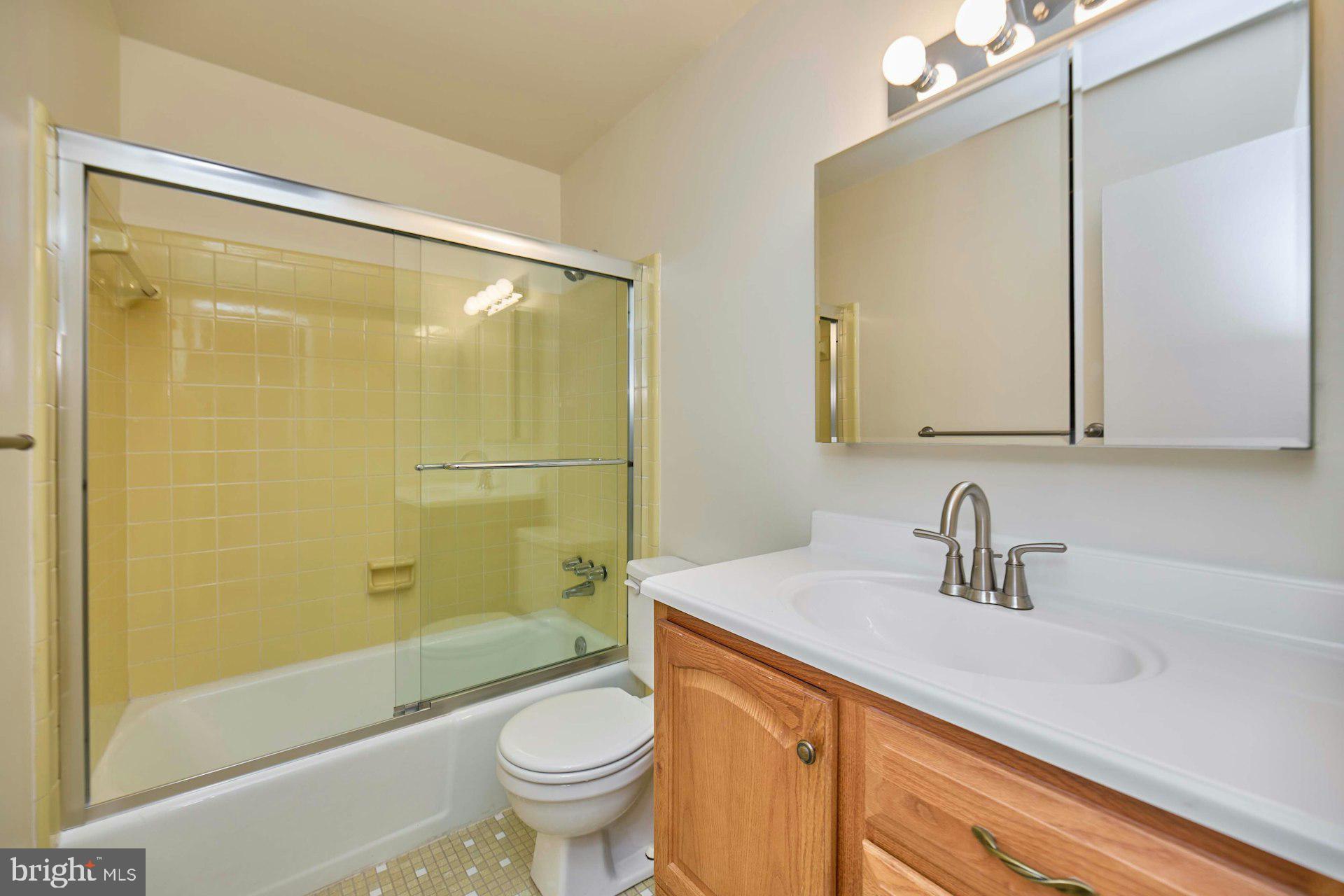 8566 Gwynedd Way Springfield, VA 22153 - Photo 24 of 61 a bathroom with a sink a toilet and shower
