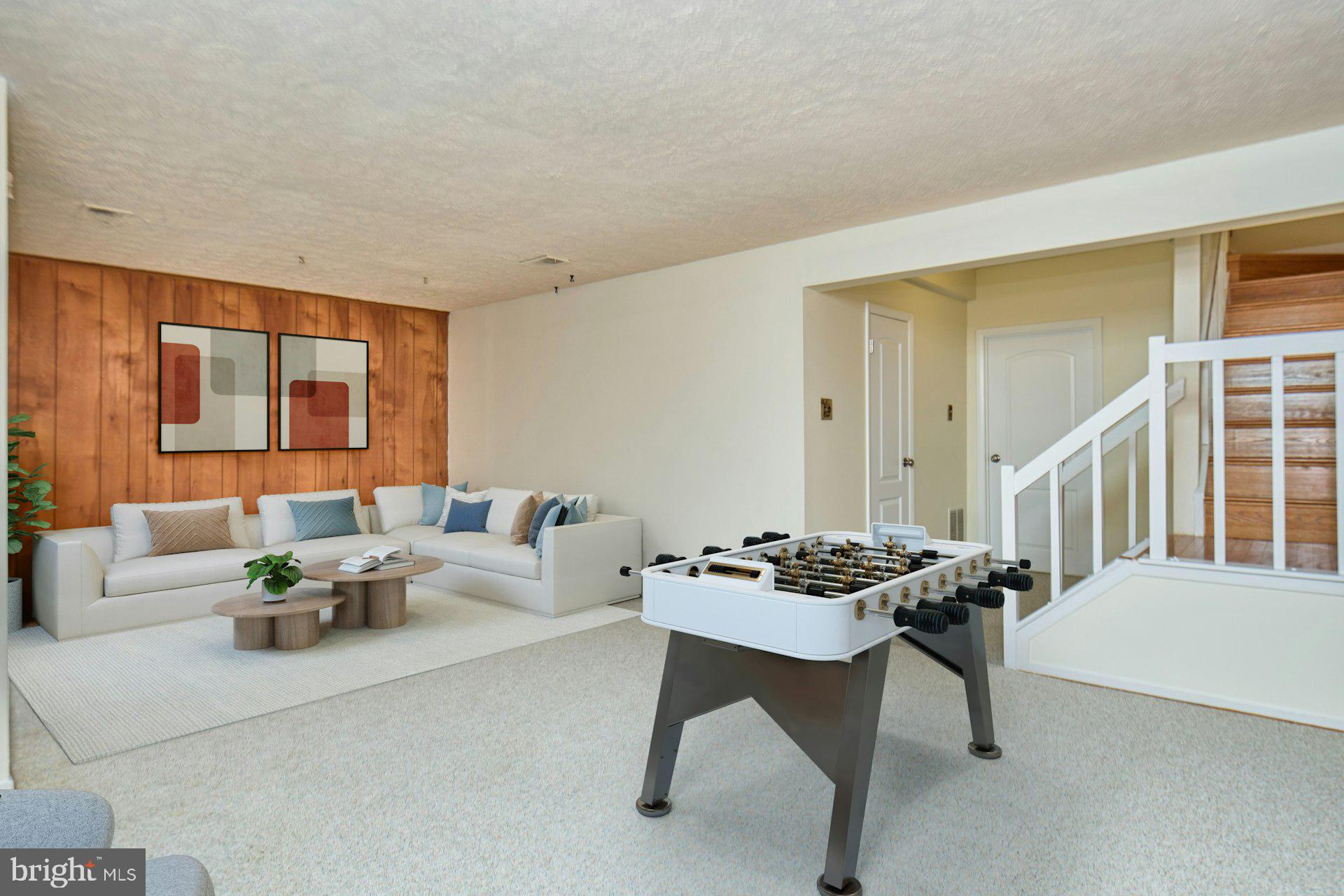 8566 Gwynedd Way Springfield, VA 22153 - Photo 27 of 61 a living room with furniture and a table