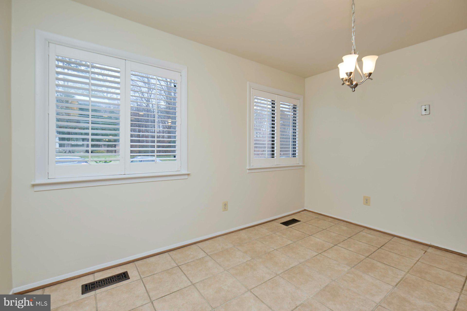 8566 Gwynedd Way Springfield, VA 22153 - Photo 36 of 61 a view of a livingroom with a ceiling fan and window